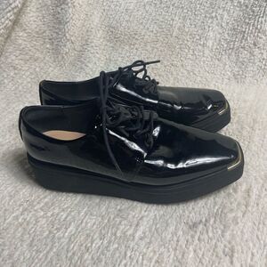 Aldo Black Patent Leather platform wedge lace up shoes SZ9 with gold accents.